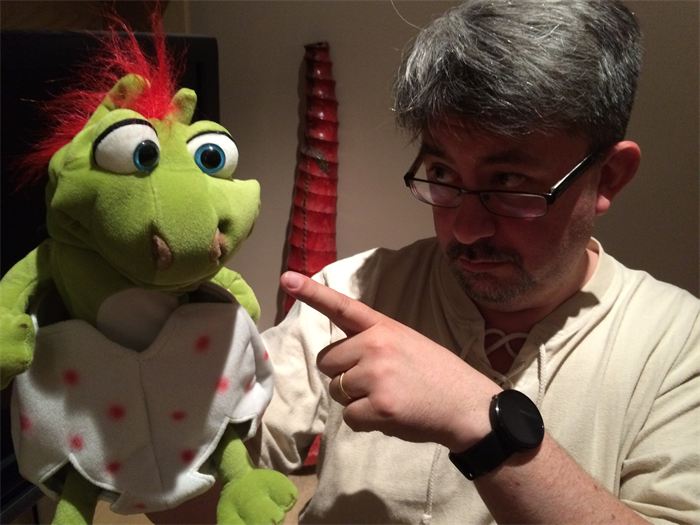 Paul pointing at the frog puppet